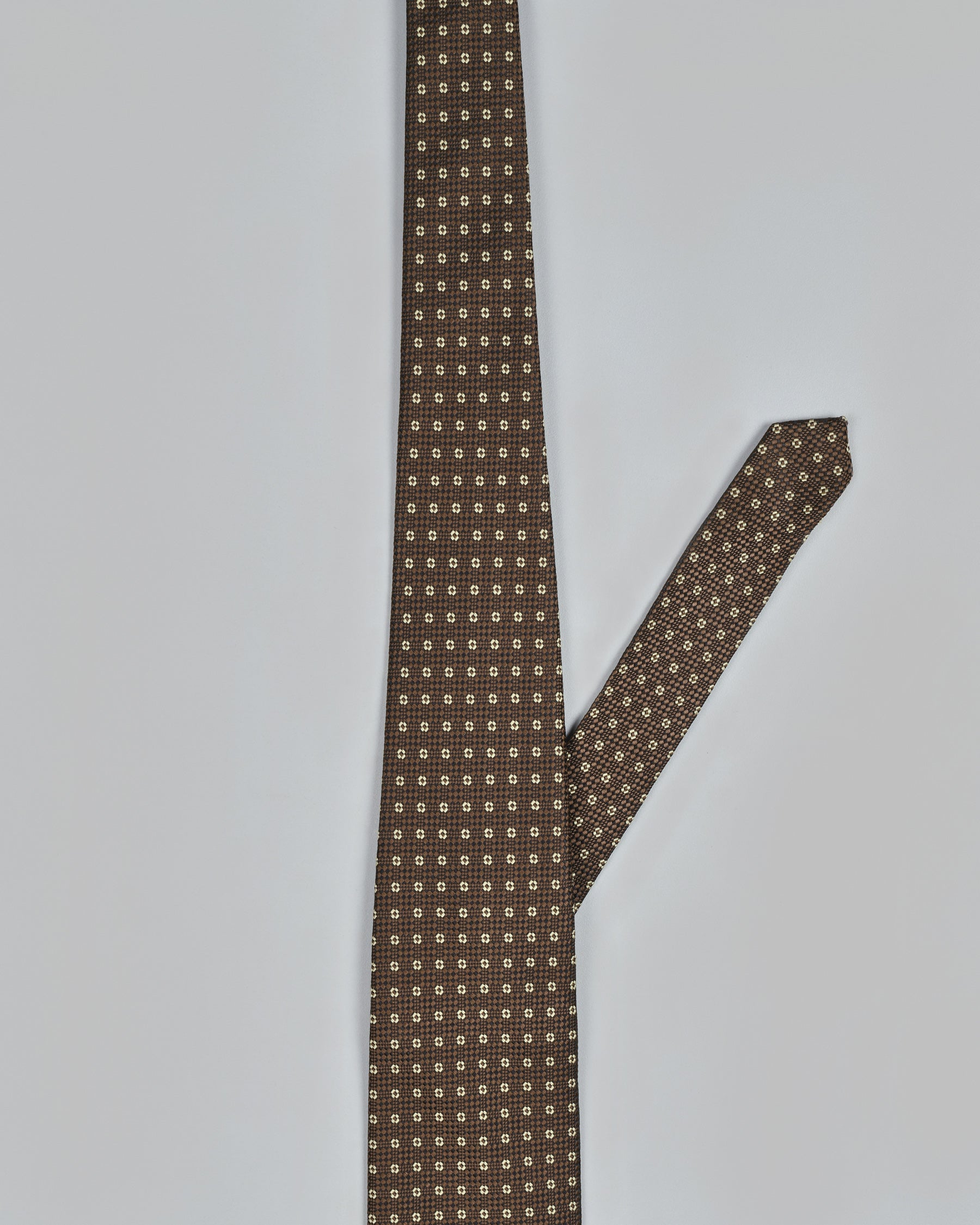 Tana with Metallic Bronze Geometric Patterned Tie and Free Pocket Square